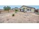 Large, private backyard with mature trees, offering ample space for entertaining and outdoor activities at 12425 N 127Th Dr, El Mirage, AZ 85335