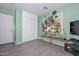 Bright bedroom with a plant stand, closet and light-filled window at 12425 N 127Th Dr, El Mirage, AZ 85335