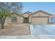 Attractive single-Gathering home featuring a two-car garage, neutral stucco, and low-maintenance desert landscaping at 12425 N 127Th Dr, El Mirage, AZ 85335
