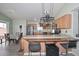 Well-equipped kitchen with stainless steel appliances and bar stool seating at 12425 N 127Th Dr, El Mirage, AZ 85335