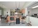 Bright kitchen featuring bar seating and a view into the office space at 12425 N 127Th Dr, El Mirage, AZ 85335