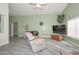 Comfortable living room with new floors, a ceiling fan, and neutral paint, creating a relaxing atmosphere at 12425 N 127Th Dr, El Mirage, AZ 85335