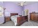 Charming primary bedroom featuring hardwood furniture and a ceiling fan at 12425 N 127Th Dr, El Mirage, AZ 85335