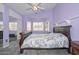 Serene main bedroom with a bay window and access to the bathroom at 12425 N 127Th Dr, El Mirage, AZ 85335