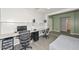 Home office space with two workstations and new floors, providing a dedicated area for productivity at 12425 N 127Th Dr, El Mirage, AZ 85335