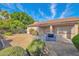 Spacious backyard with a concrete patio area and a stainless steel grill at 12607 W Highland Ave, Litchfield Park, AZ 85340