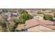 Beautiful backyard featuring lush landscaping, providing a private retreat, and home solar panels at 12607 W Highland Ave, Litchfield Park, AZ 85340