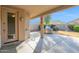View of a patio, grill and landscaped backyard, including desert landscaping and privacy wall at 12607 W Highland Ave, Litchfield Park, AZ 85340