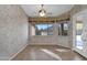 Cozy dining area with tile flooring, natural light, and access to the backyard, perfect for gatherings at 12607 W Highland Ave, Litchfield Park, AZ 85340