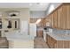 Spacious kitchen featuring a large island with sink, white appliances, and ample counter space for cooking at 12607 W Highland Ave, Litchfield Park, AZ 85340