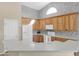 Well-lit kitchen showcasing plenty of cabinet space and white appliances, ideal for culinary enthusiasts at 12607 W Highland Ave, Litchfield Park, AZ 85340