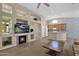 Inviting living area features fireplace, built-in shelves, and smooth transition to the kitchen at 12607 W Highland Ave, Litchfield Park, AZ 85340