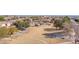 Scenic view of a community park, with walking paths, playground, and open green spaces at 12607 W Highland Ave, Litchfield Park, AZ 85340