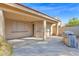 Covered patio area with concrete flooring and outdoor kitchen with built-in stainless steel grill at 12607 W Highland Ave, Litchfield Park, AZ 85340