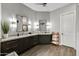 This bathroom with double sinks and granite countertop is elegant at 12970 W Kokopelli Dr, Peoria, AZ 85383