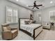 This beautifully designed bedroom with a ceiling fan and plantation shutters is very inviting at 12970 W Kokopelli Dr, Peoria, AZ 85383