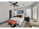 This main bedroom is spacious and bright with a king bed and lots of light at 12970 W Kokopelli Dr, Peoria, AZ 85383