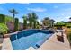 Sparkling pool area with well-maintained landscaping, patio, and plenty of sunshine at 12970 W Kokopelli Dr, Peoria, AZ 85383
