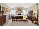 Bright bedroom featuring a vaulted ceiling, a ceiling fan, a large bed, and matching dressers at 14266 W Kiowa Trl, Surprise, AZ 85374