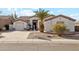 Beautiful single-story home with two-car garage, desert landscaping, and tile roof at 1653 W Morelos St, Chandler, AZ 85224