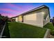 Spacious backyard with lush green artificial lawn, offering low maintenance and year-round beauty at 17165 W Piperton St # 181, Surprise, AZ 85388