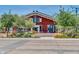 Inviting clubhouse showcasing outdoor seating area, manicured landscaping, and charming architectural details at 17165 W Piperton St # 181, Surprise, AZ 85388