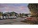 A community clubhouse with golf cart parking and a well-maintained exterior at 17165 W Piperton St # 181, Surprise, AZ 85388