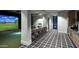 Entertainment room featuring a golf simulator, bar seating, and designer finishes at 17165 W Piperton St # 181, Surprise, AZ 85388