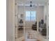 Office featuring glass doors, desk, and comfortable seating at 17165 W Piperton St # 181, Surprise, AZ 85388
