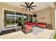 Covered patio featuring comfortable seating and ceiling fan at 17165 W Piperton St # 181, Surprise, AZ 85388