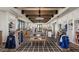 Beautifully designed pro shop with custom shelving, wood beams, and display tables at 17165 W Piperton St # 181, Surprise, AZ 85388