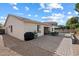 The backyard has a paved patio, gravel border, and cozy outdoor seating at 17286 W Morning Glory St, Goodyear, AZ 85338