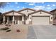 Charming single-story home with stucco exterior, tile roof, and a well-maintained desert landscape at 17286 W Morning Glory St, Goodyear, AZ 85338