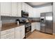 Well-equipped kitchen with stainless steel appliances, granite countertops, and ample cabinet space at 17286 W Morning Glory St, Goodyear, AZ 85338