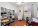Bright office with shelving for storage and a ceiling fan at 17286 W Morning Glory St, Goodyear, AZ 85338
