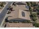 Aerial view of home featuring rooftop solar panels, desert landscaping, and a tile roof at 1775 E Tangelo Pl, Queen Creek, AZ 85140