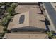Aerial view of home with rooftop solar panels, tile roof, and well-maintained desert landscaping at 1775 E Tangelo Pl, Queen Creek, AZ 85140