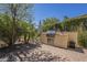 Outdoor kitchen area features built-in barbecue grill, lush landscaping and outdoor seating at 1775 E Tangelo Pl, Queen Creek, AZ 85140