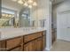 Bathroom vanity features dual sinks, ample counter space, and storage in a well lit space at 1775 E Tangelo Pl, Queen Creek, AZ 85140