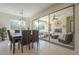 The dining room features contemporary lighting and seamless indoor/outdoor flow to the patio at 1775 E Tangelo Pl, Queen Creek, AZ 85140