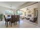 The dining room boasts modern lighting and effortless transition to an outdoor entertainment area at 1775 E Tangelo Pl, Queen Creek, AZ 85140