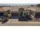 Charming single-story home featuring desert landscaping, tile roof, and a two-car garage at 1775 E Tangelo Pl, Queen Creek, AZ 85140