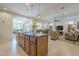 Bright living room showcases an open-concept design, perfect for modern living with tile flooring at 1775 E Tangelo Pl, Queen Creek, AZ 85140