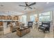 Open-concept living room featuring a comfortable sofa set and large windows at 1775 E Tangelo Pl, Queen Creek, AZ 85140