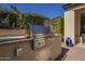 Built-in stainless steel outdoor grill perfect for entertaining in this outdoor kitchen with natural gas at 1775 E Tangelo Pl, Queen Creek, AZ 85140