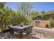 Outdoor patio with built in stainless steel grill and dining area at 1775 E Tangelo Pl, Queen Creek, AZ 85140