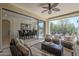 Comfortable seating on a covered patio provides backyard views; dining room inside has easy access at 1775 E Tangelo Pl, Queen Creek, AZ 85140
