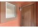 Close-up of front door entrance featuring stone trim and window with blinds at 1920 E Bell Rd # 1019, Phoenix, AZ 85022