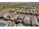 An aerial view showcases a well-planned community with tidy homes, landscaped yards, and convenient street access at 20728 W Legend Trl, Buckeye, AZ 85396