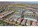 An expansive aerial view features a modern residential community set against a backdrop of stunning mountain scenery at 20728 W Legend Trl, Buckeye, AZ 85396